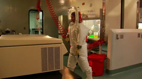 Scientists in bubble suits work in laboratory 스톡 동영상 21529142