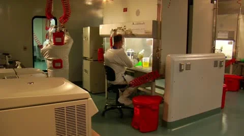 Scientists in bubble suits work in laboratory 스톡 동영상 21529368
