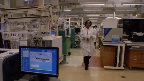 Scientists at the CDC Center For Disease Control use laboratory equipment to Stock Footage 123372875