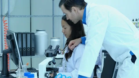 Scientists colleague talking in laboratory or medical center. Stock Footage 106855920