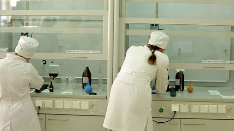 Scientists conduct experiments in the laboratory Stock Footage 76860749