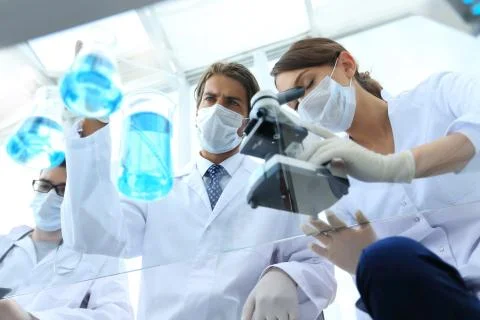 Scientists conducting research in a lab environment Stock Photos