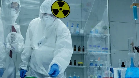 Scientists in a Coverall Conducting a Research at Laboratory. Stock Footage 92995491