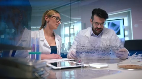Scientists discuss creation of new cure for cancer Stock Footage 95008907