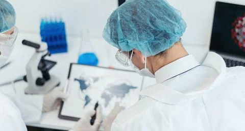 Scientists discussing information about the spread of the coronavirus. Elements 스톡 사진