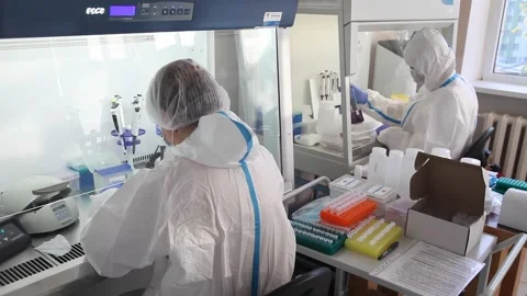 Scientists doctors work in the laboratory. in protective suits Stock-Footage 141883717