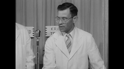 Scientists doing experiment with soil at press conference - 1953 Stock Footage 95197700