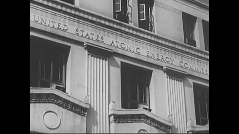 Scientists enter the United States, Atomic Energy Commission building, conduct a Stock Footage 141575990
