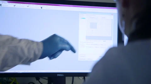 Scientists examine data on a computer screen Stock Footage 47202756