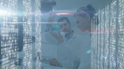 Scientists examining blue liquid flask inside high-tech science lab, overlaying Stock Footage 328648947
