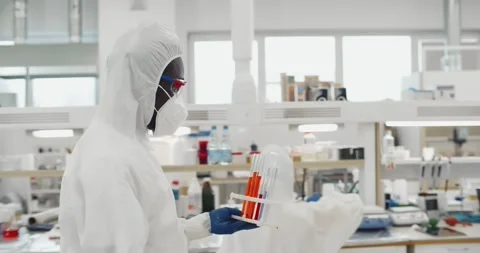 Scientists examining vaccine evolution using high tech researching technology Stock Footage 243641159