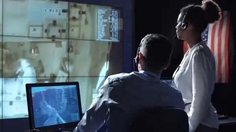 Scientists in flight control center Stock Footage 79076884