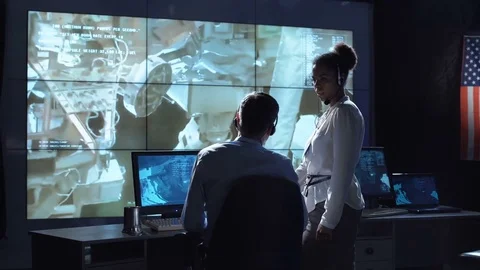 Scientists in flight control center Stock Footage 79077101