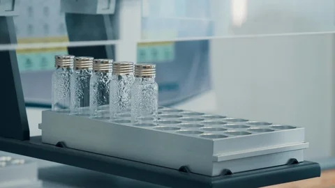 Scientist's hand puts a bottle with an experimental solution 스톡 동영상 118063162