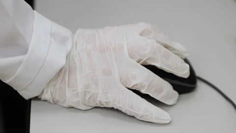 Scientists hand using a computer mouse in a laboratory. Stock Footage 313169826