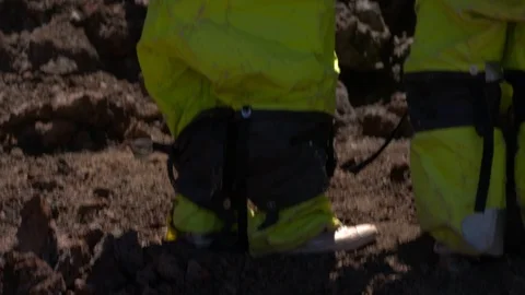 Scientists holding rock in mars simulated landscape Stock Footage 93533701