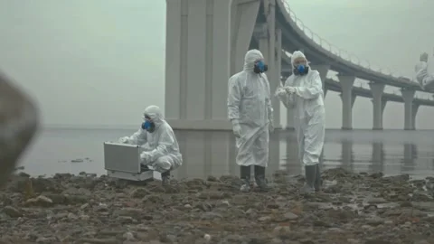 Scientists Investigate Polluted River Stock Footage 320912417