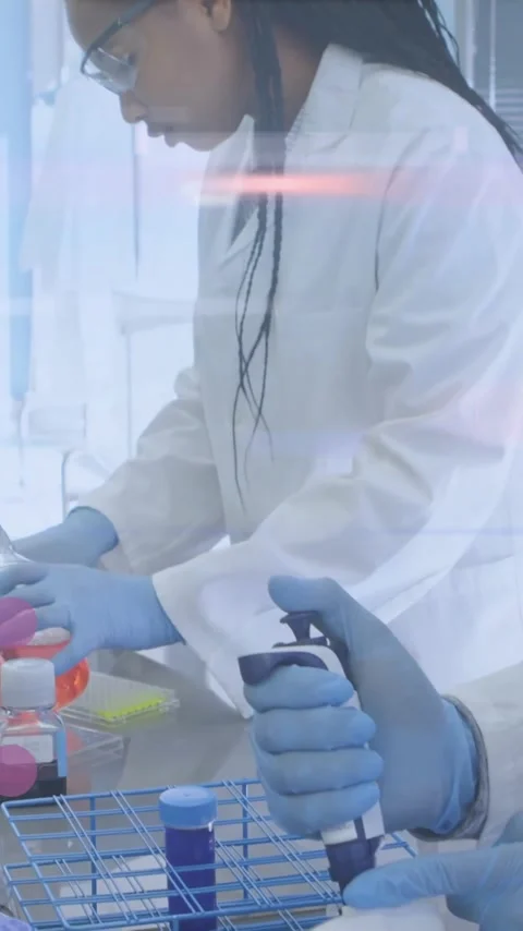 Scientists in lab coats working with test tubes, data processing animation Stock Footage 320183830