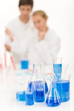 Scientists in laboratory - blue liquid Stock Photos