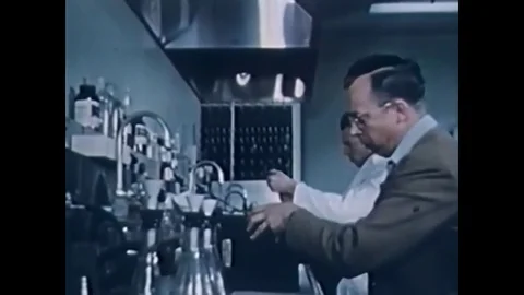 Scientists in a laboratory study atomic samples at Los Alamos, New Mexico, in Stock Footage 79423661