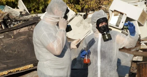 Scientists in landfill study samples of infectious materials, report on tablet Stock Footage 119052393