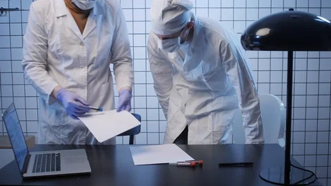 Scientists learn test results in coronavirus researching lab Stock Footage 127214855