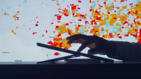 Scientists look at Covid-19 map of the USA on computer Stock Footage 134852632