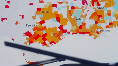 Scientists look at Covid-19 map of the USA on computer Stock Footage 134852648