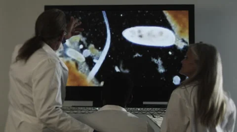 Scientists look at screen Stock Footage 62944414
