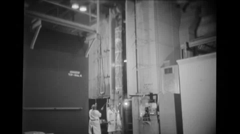 Scientists moving super voltage electron beam tube Stock Footage