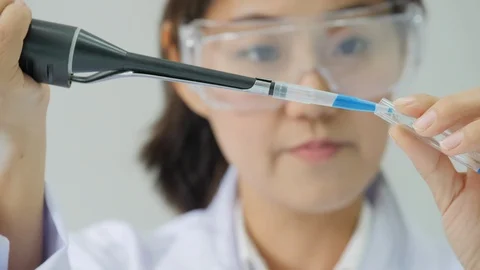 Scientists performs medical tests in laboratory. Stock Footage 93820499