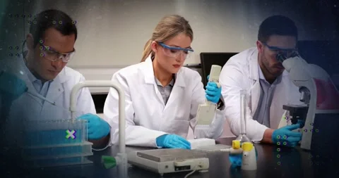 Scientists pipetting samples at lab bench, with animated data charts and Stock Footage 325706395