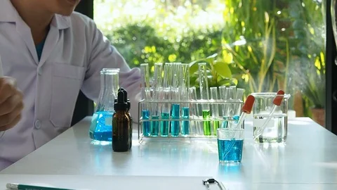 Scientists preparing experimental equipment before beginning the experiment. Stock Footage 125565413