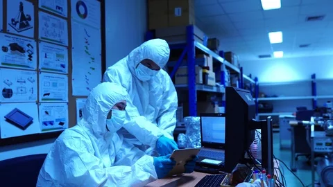 Scientists with protective clothing for work in laboratories  Stock Footage 115472502