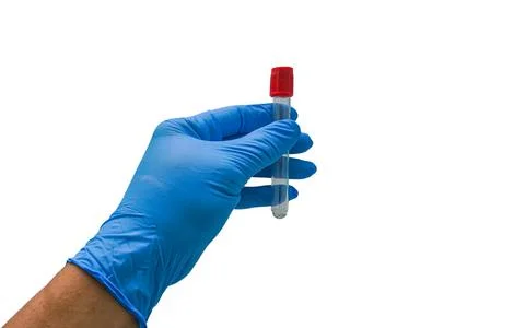 Scientists in protective gloves hold a test tube. Stock Photos