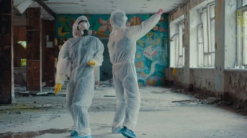 Scientists put on respirators and dance for a rap clip. Video stock 111449317