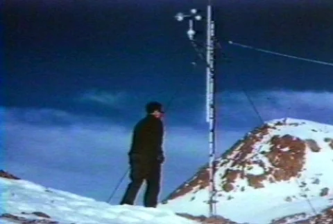 Scientists reading the results of wind speed at a research station. Video stock 122212203