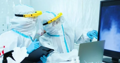 Scientists Studying Xray Of Lung Video stock 130791131