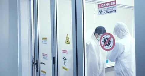 Scientists talking and wearing protection great results of completed Stock Footage 133077337