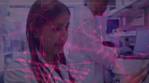 Scientists tapping tablet in lab activating network overlay while loading Stock Footage 310971485