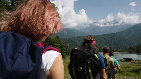 Scientists team approach comfortable research base on the shores of mountain Stock Footage 208879044