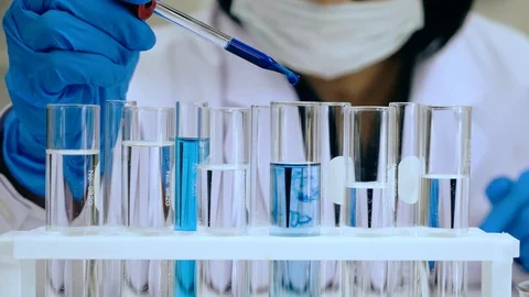Scientists test for Covid-19 or Corona virus By using science tubes Stock Footage 124788423