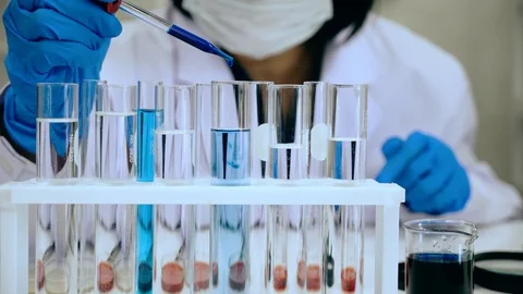 Scientists test for Covid-19 or Corona virus By using science tubes Stock Footage 124788743