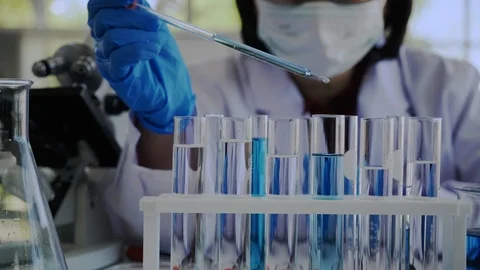 Scientists test for COVID-19 or Coronavirus By using science tubes to research Stock Footage 125524802