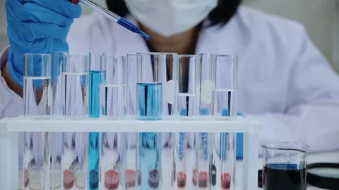 Scientists test for COVID-19 or Coronavirus By using science tubes to research Stock Footage 128137677