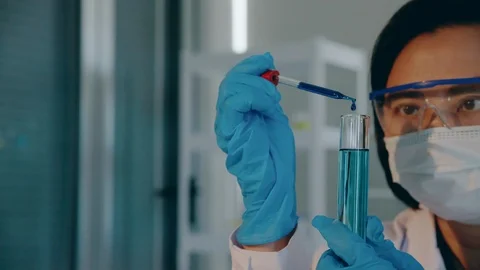 Scientists test for COVID-19 or Coronavirus By using science tubes to research Stock Footage 129418931