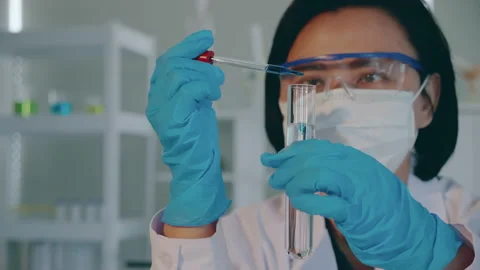 Scientists test for Covid-19 or Corona virus By using science tubes to research  Stock Footage 130340557