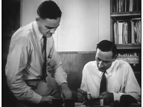 Scientists test the lasting strength of DDT in a lab in the 1940s. Stock Footage 74976468
