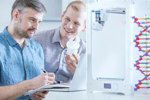 Scientists testing 3d printer 写真素材