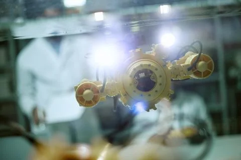 Scientists Testing Robotic Underwater Drone in Laboratory Tank Stock Photos